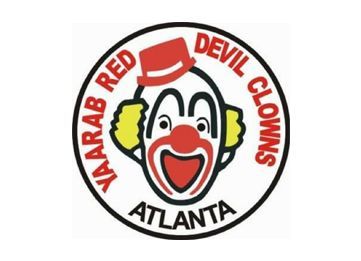 A round logo featuring a cartoon clown with a red hat, yellow hair, and a red nose, text reads