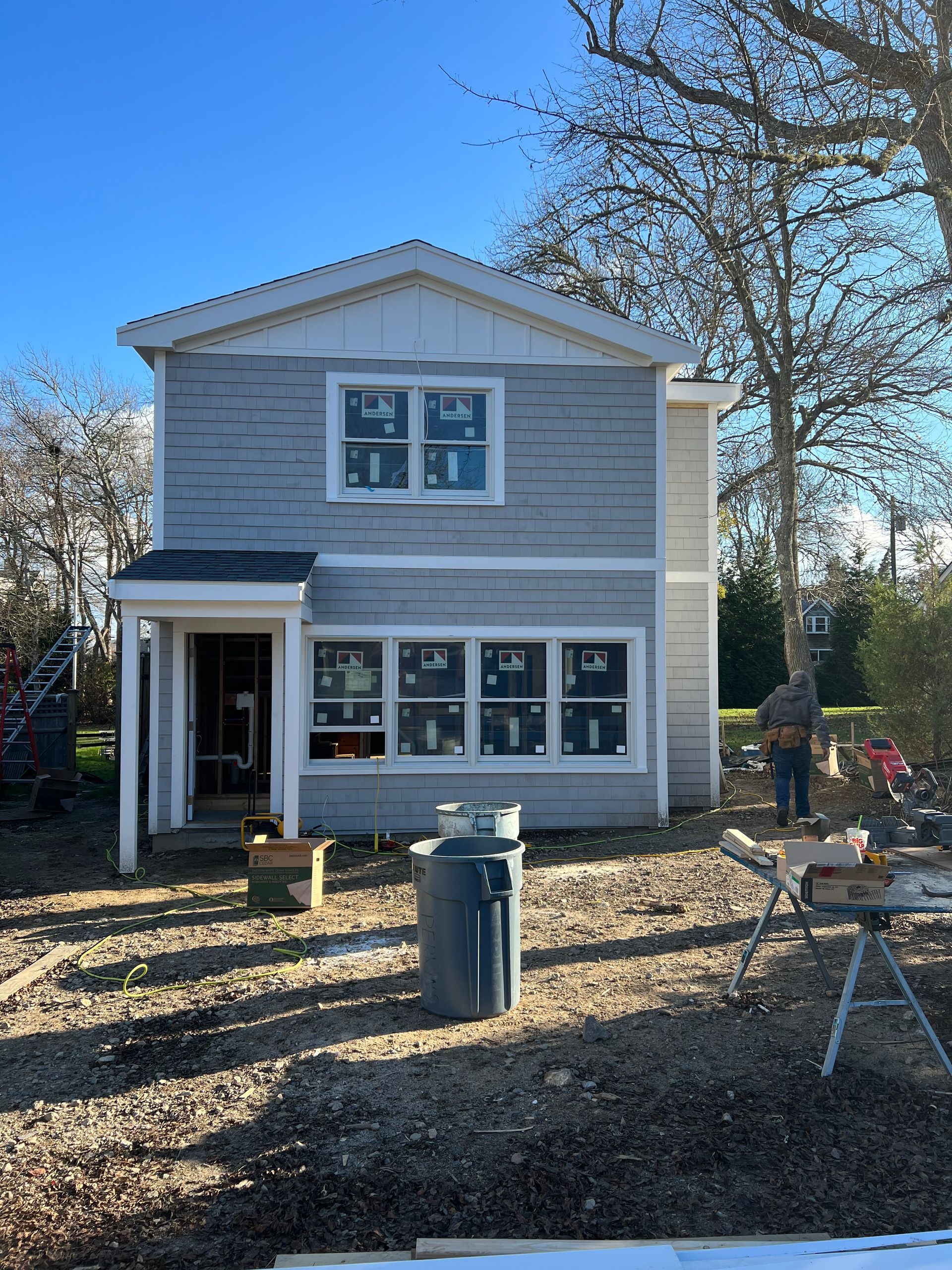 A house with a lot of windows is being built