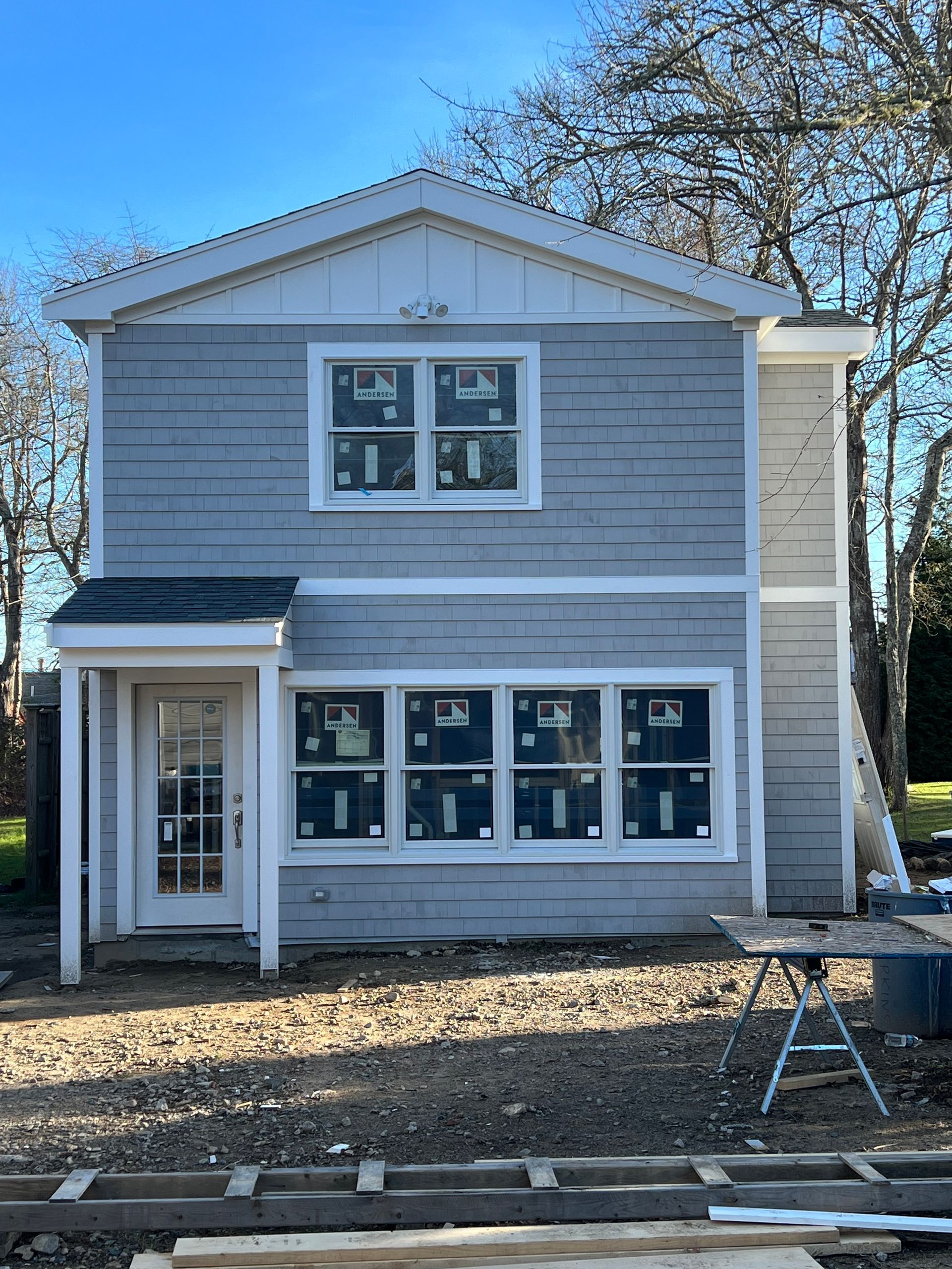 A house with a lot of windows is being built