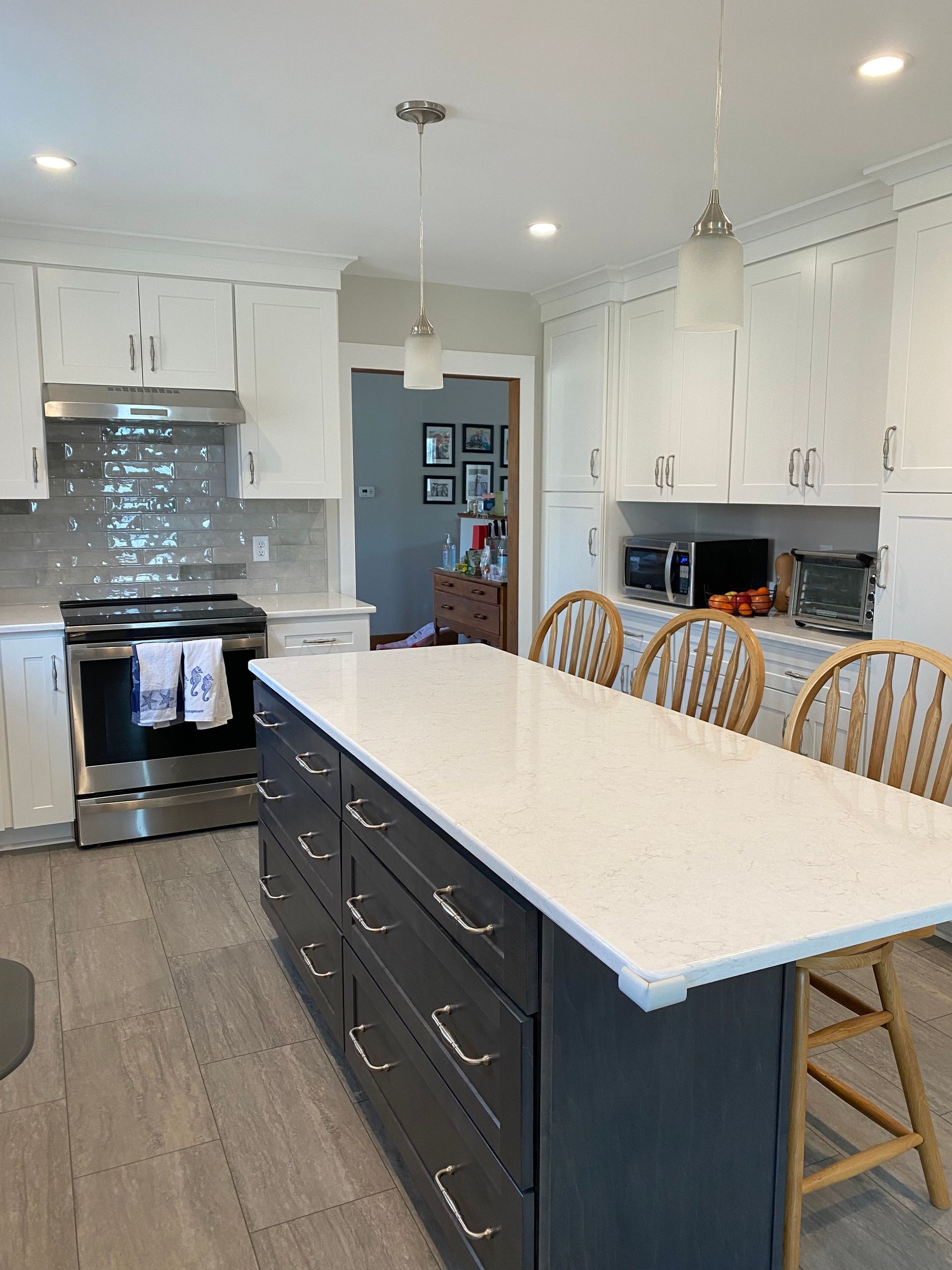 There is a large island in the middle of the kitchen.