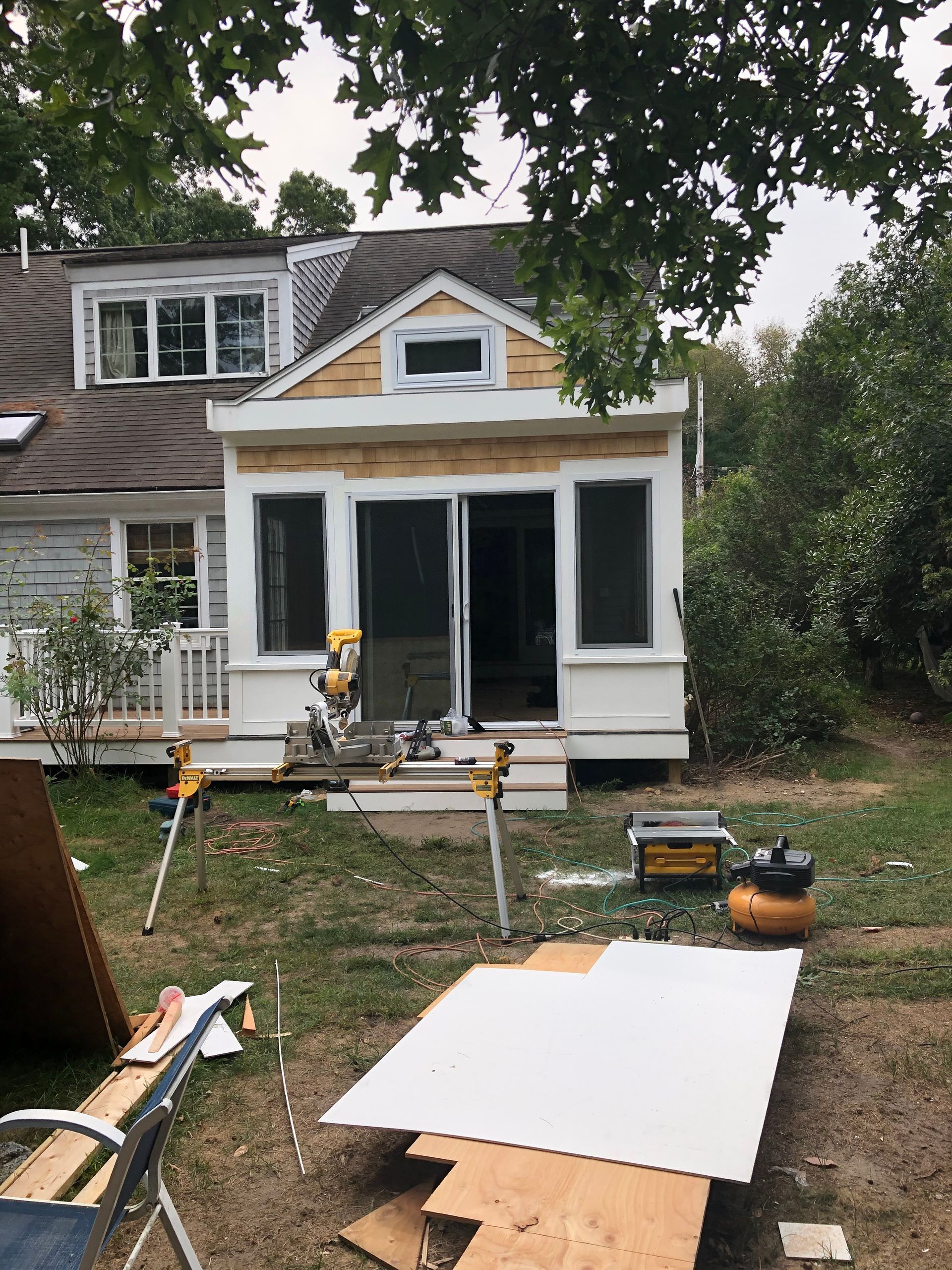 A house is being remodeled in the backyard.