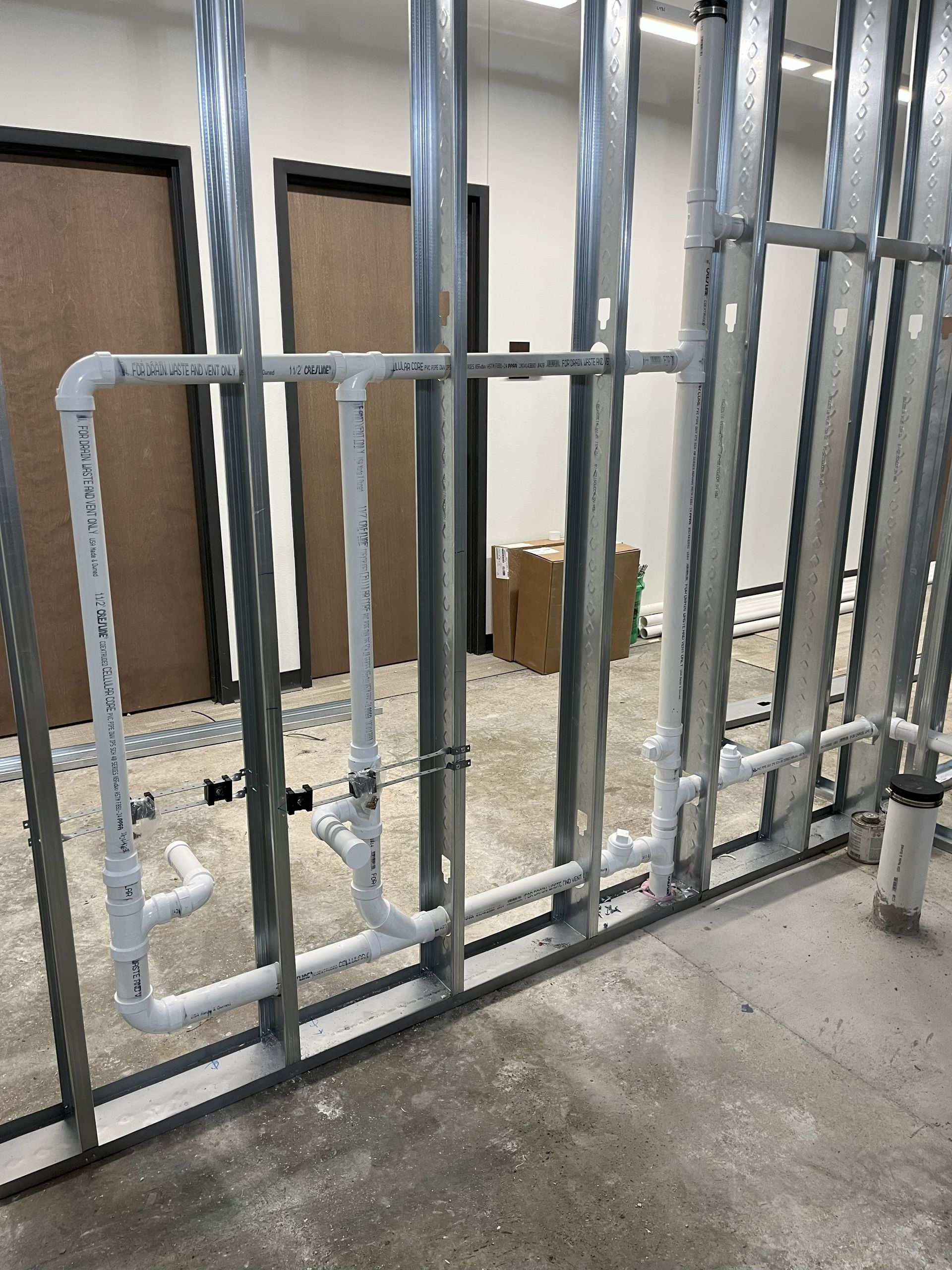 A room with a lot of pipes going through it.