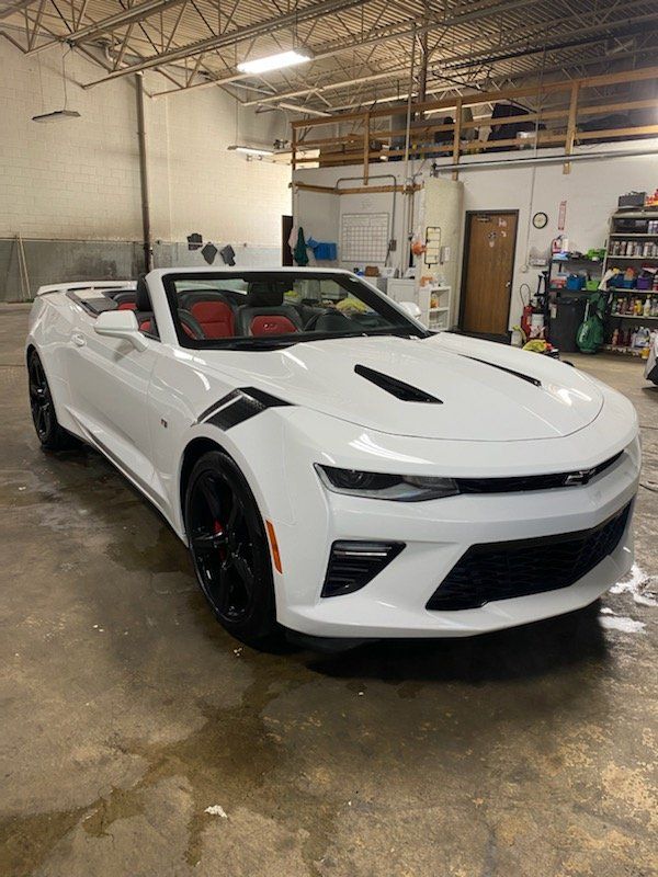 White car with top down