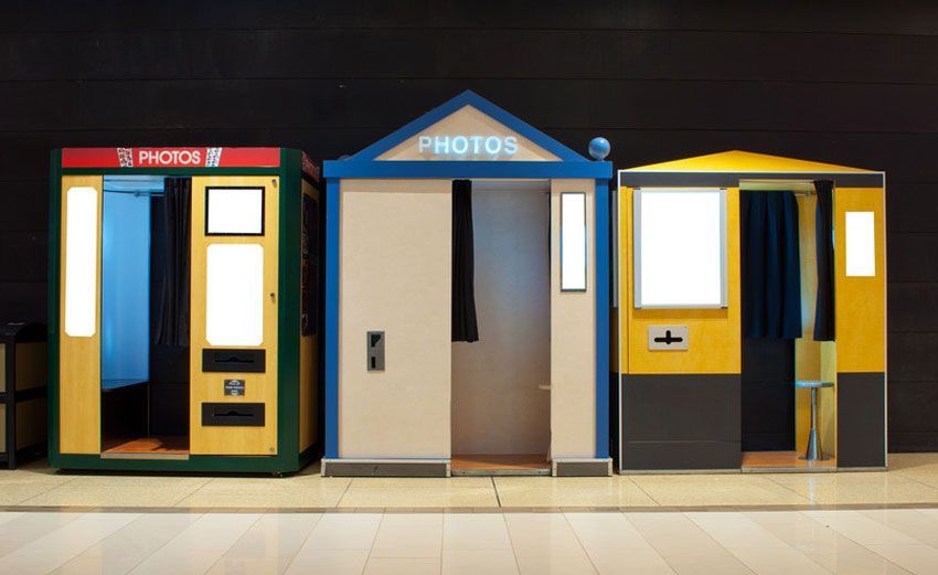 A row of photo booths are lined up in a row
