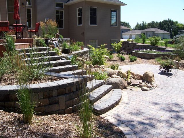 A house with a patio and stairs in front of it