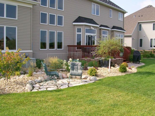 A large house with a large lawn in front of it