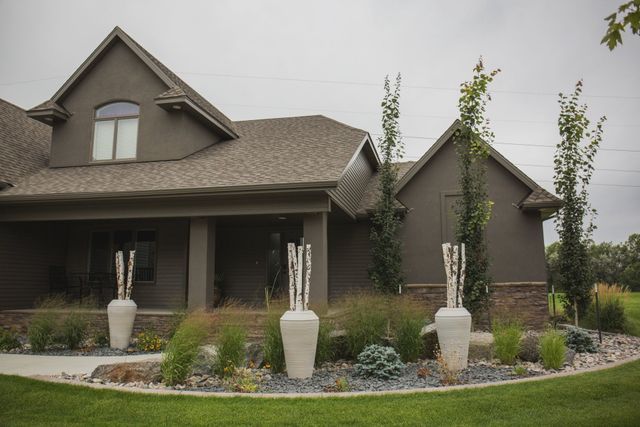 A large house with a lawn in front of it