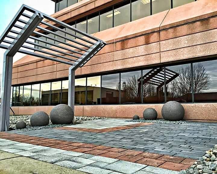 A large building with a brick walkway leading to it