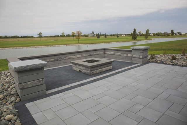 There is a fire pit in the middle of the patio.