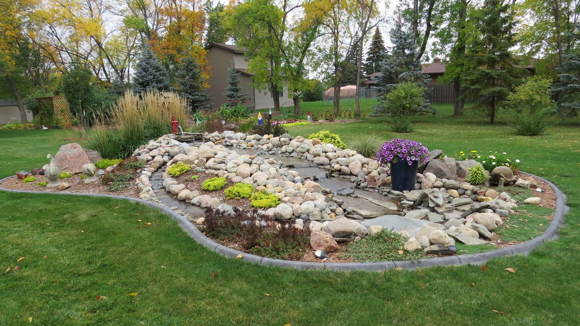 There is a waterfall in the middle of the garden.