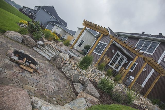 A house with a fire pit in front of it