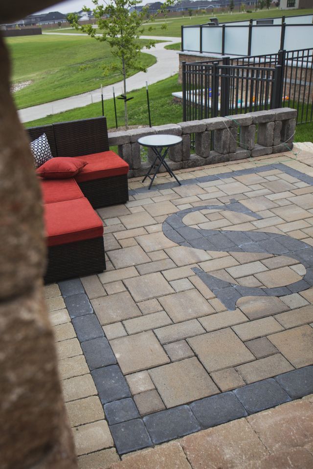 A patio with a couch and a table on it
