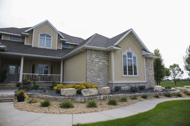 A large house with a walkway leading to it