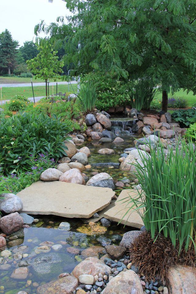 There is a small waterfall in the middle of the garden.
