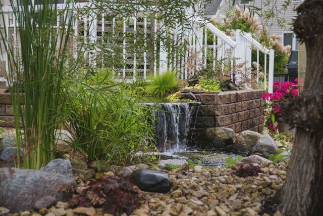 There is a waterfall in the middle of the garden.
