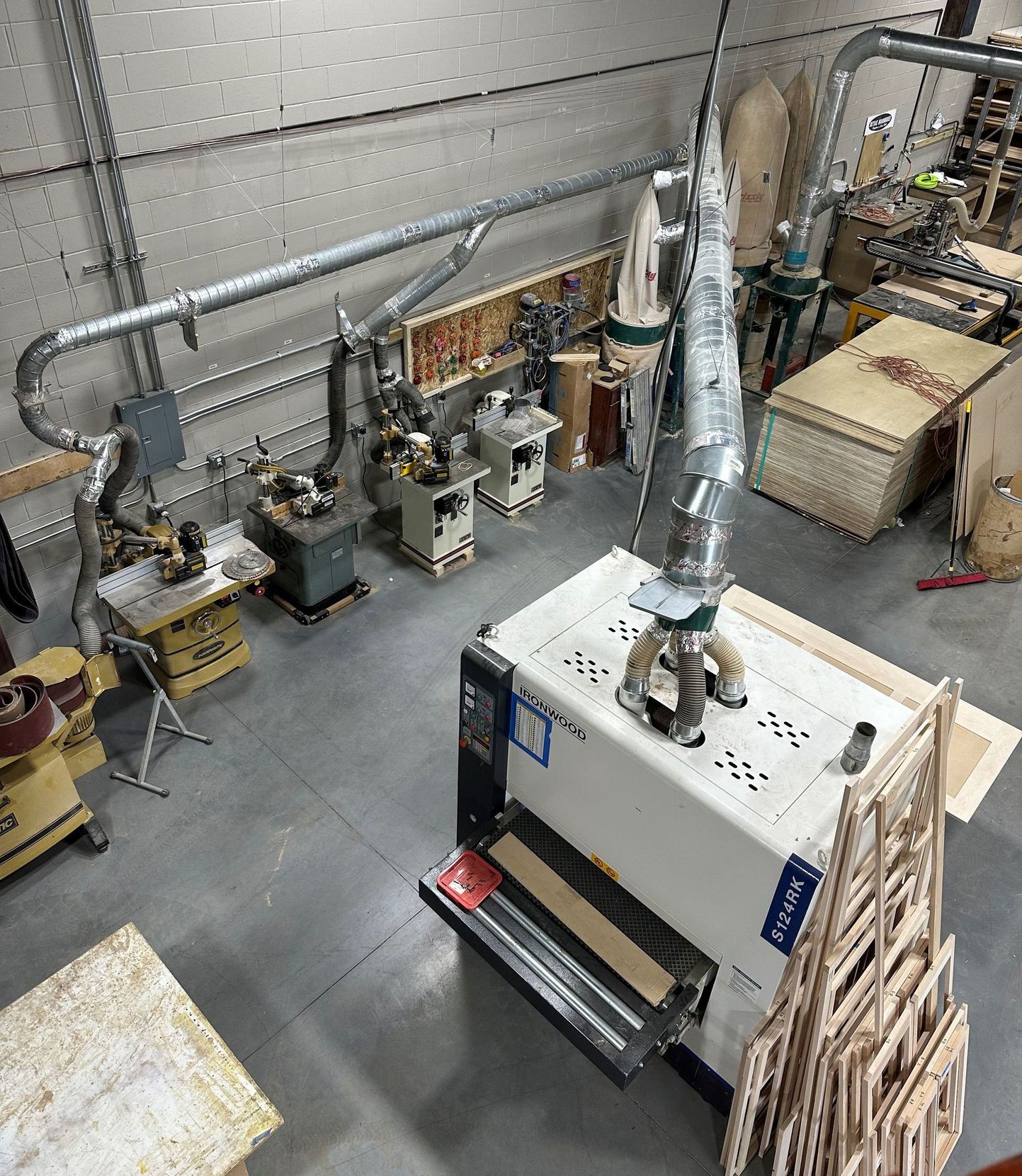 An aerial view of a workshop filled with lots of tools and machinery.