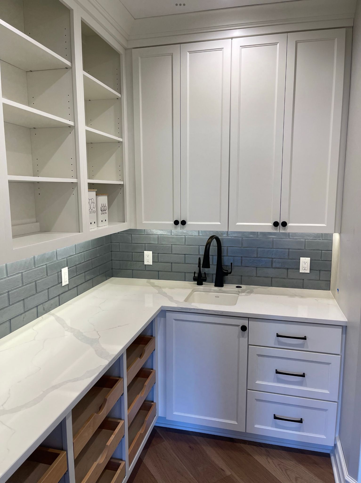 White cabinet with open shelves