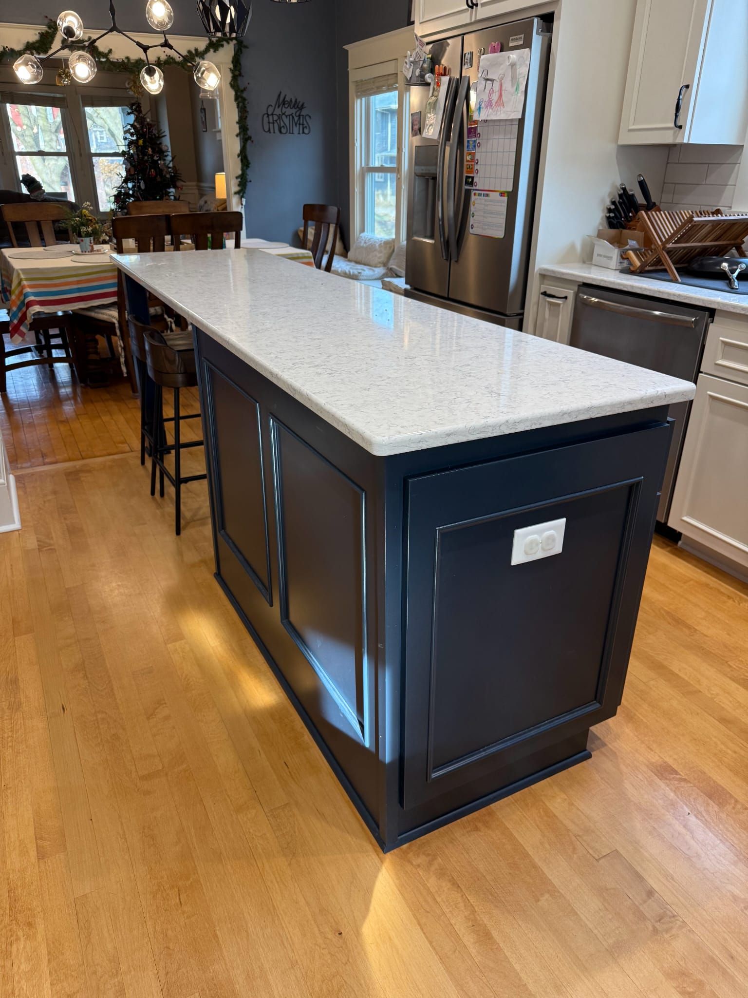 There is a large island in the middle of the kitchen.