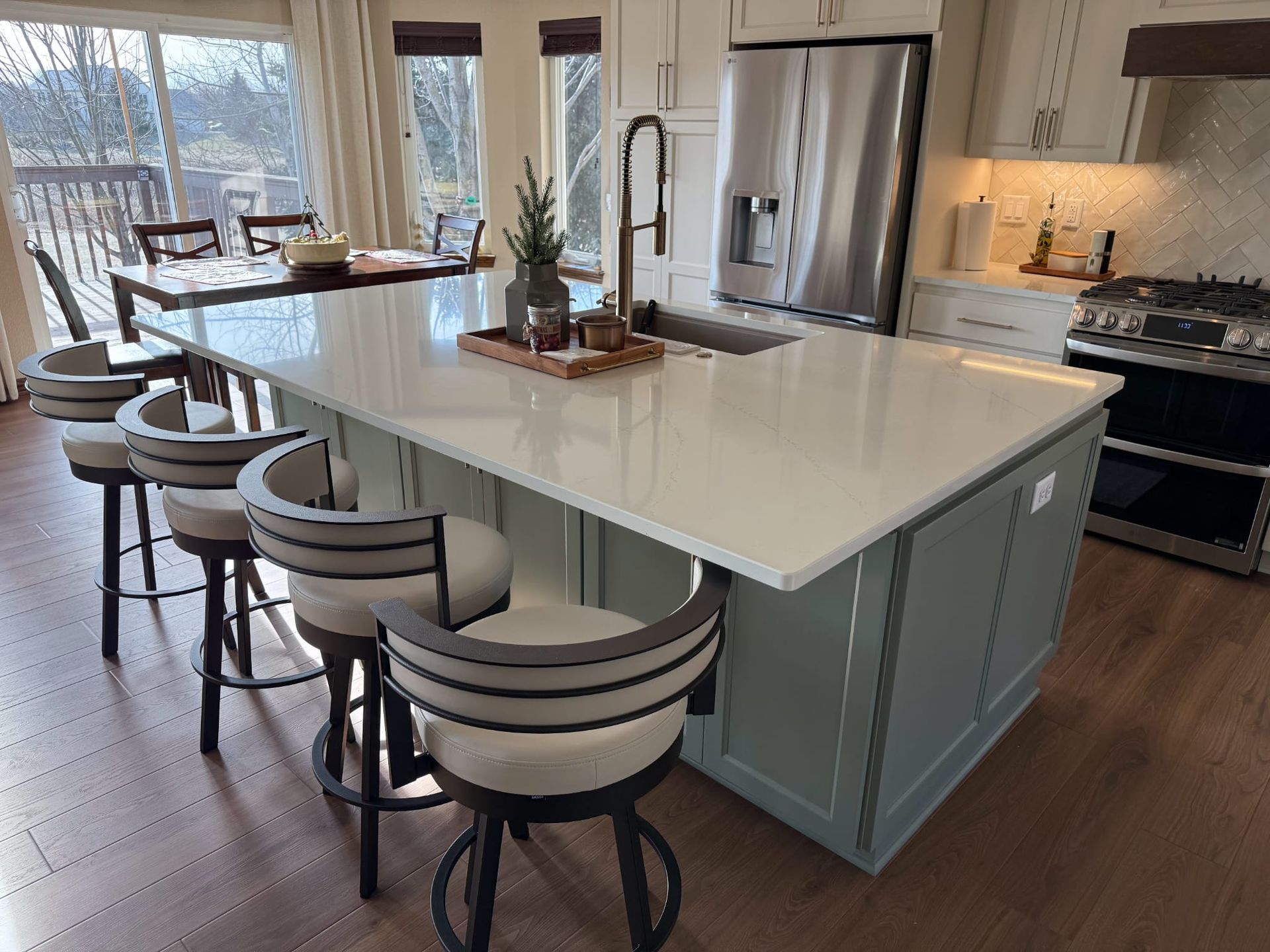 There is a large island in the middle of the kitchen.