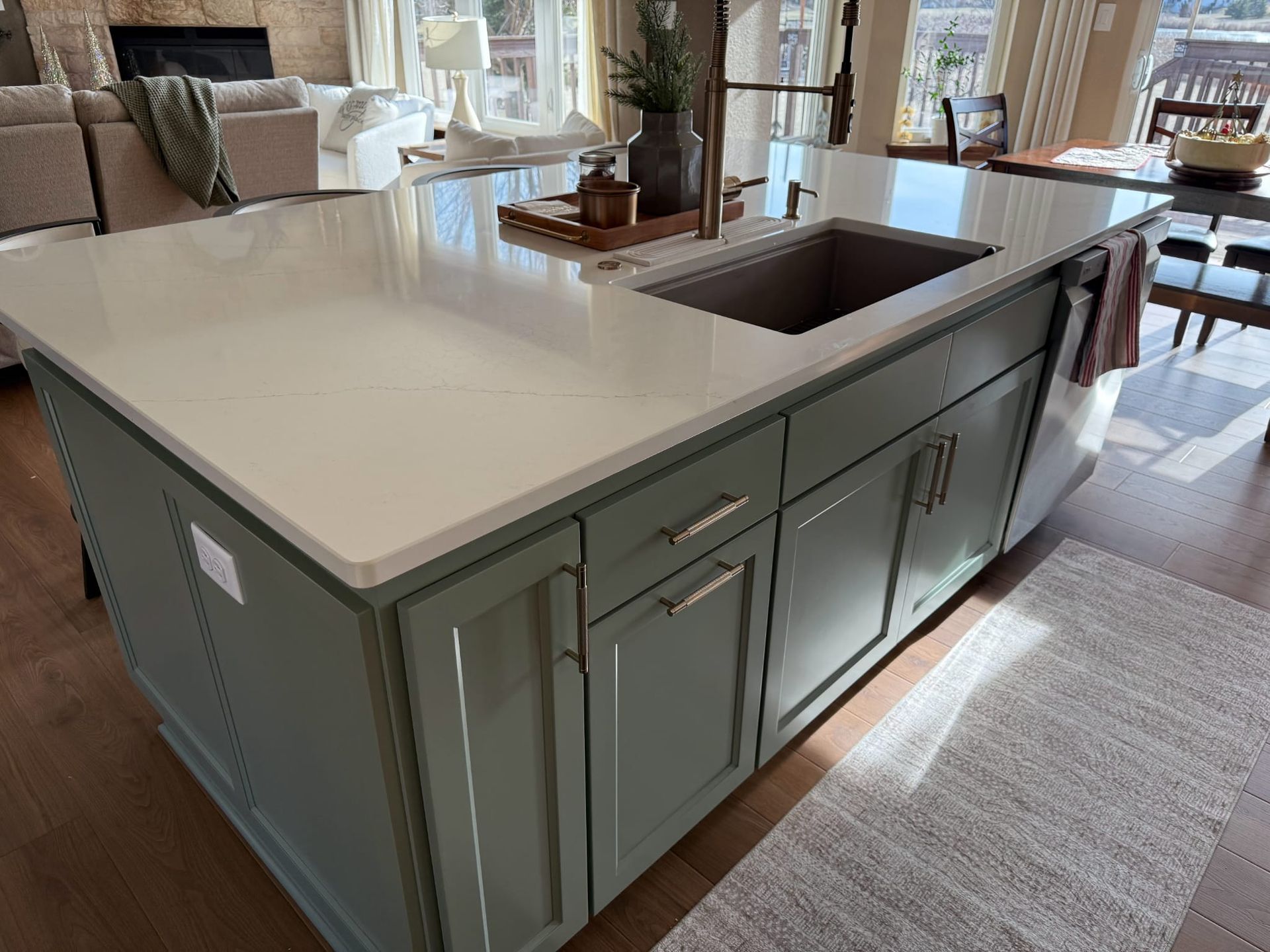 A kitchen with a large island and a sink