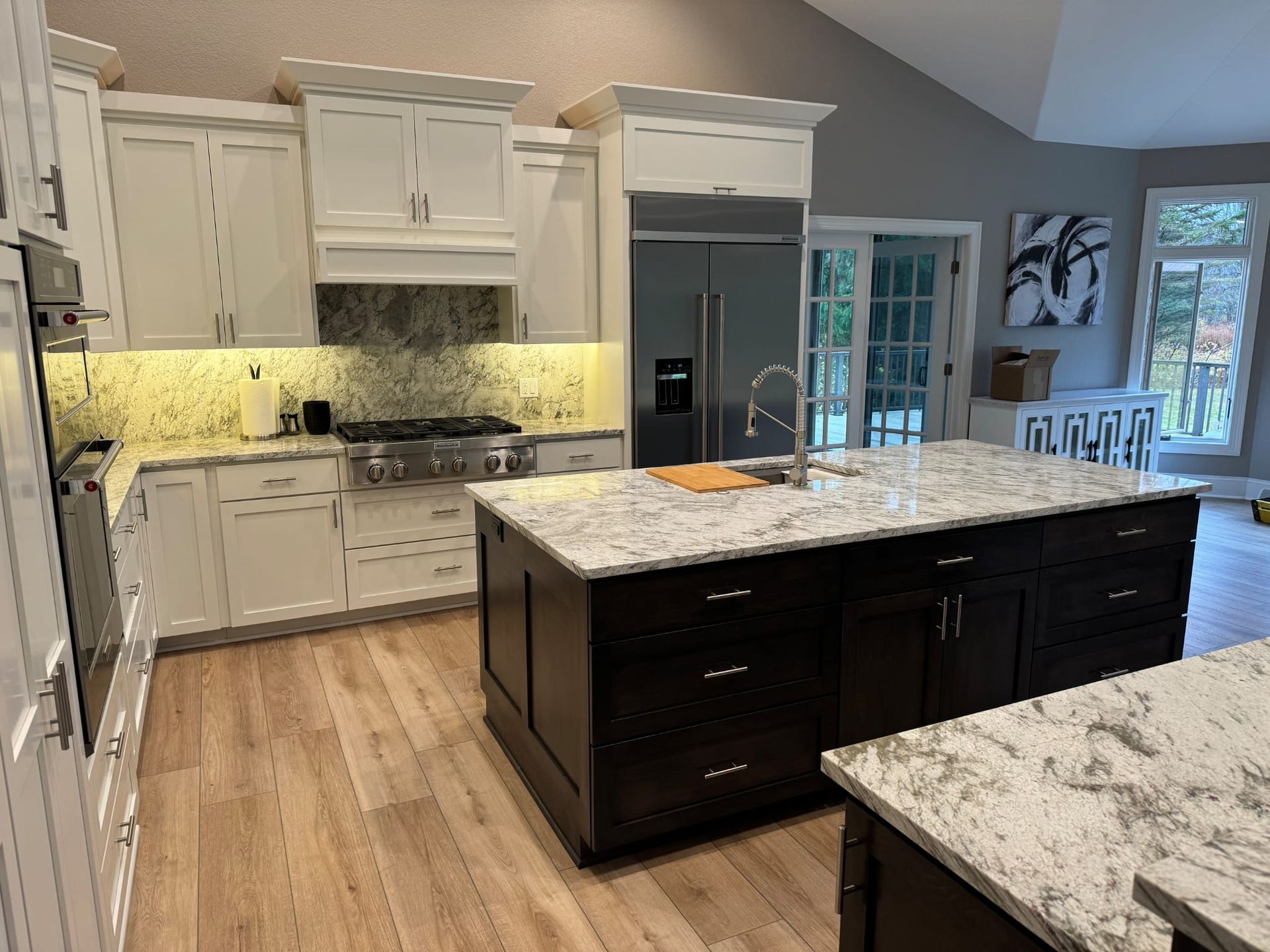 A kitchen with a large island in the middle of it.