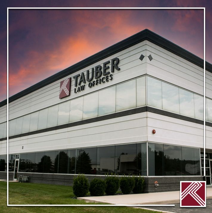 Tauber Law Offices building exterior with large glass windows at sunset
