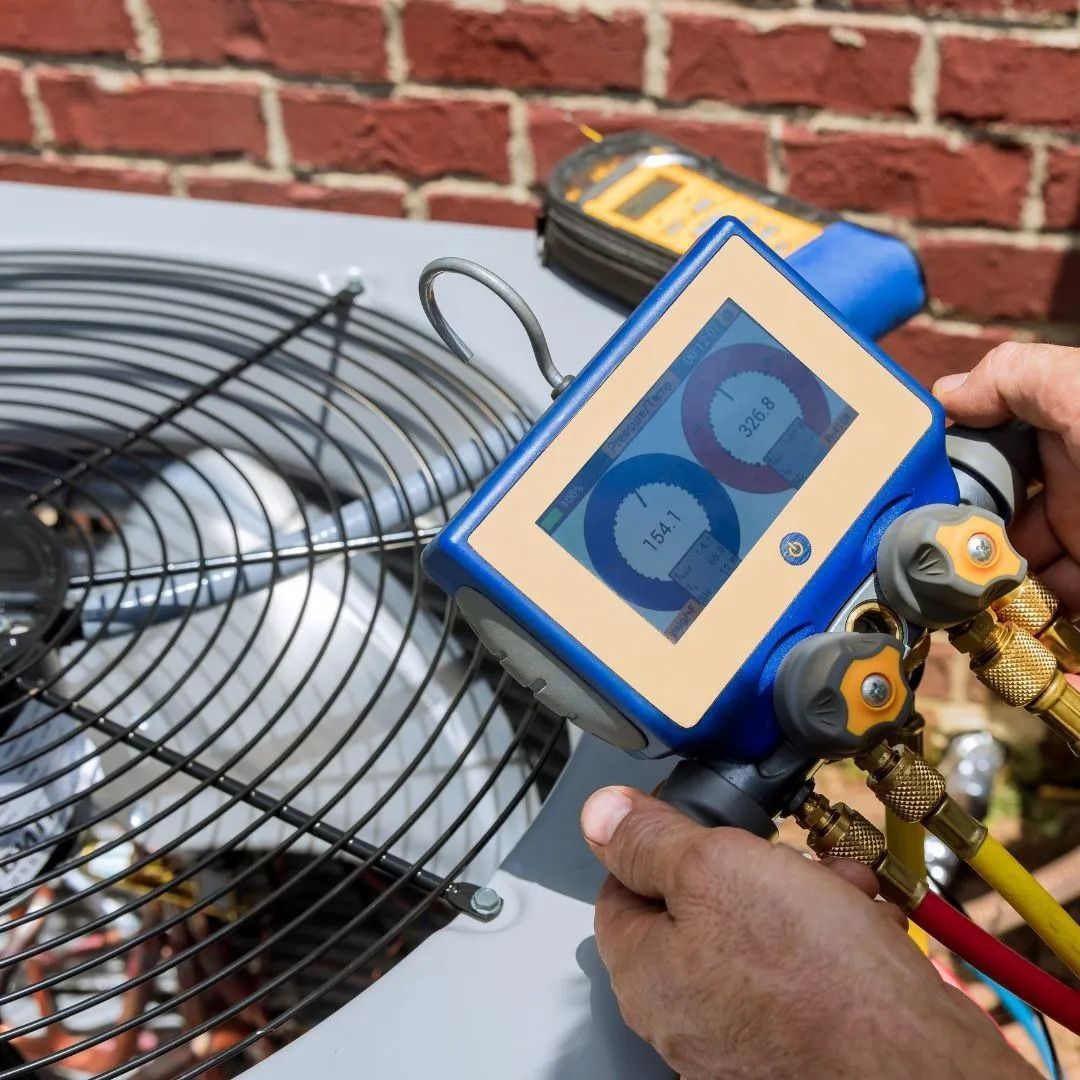 HVAC technician using diagnostic tool on air conditioning unit, outdoors.