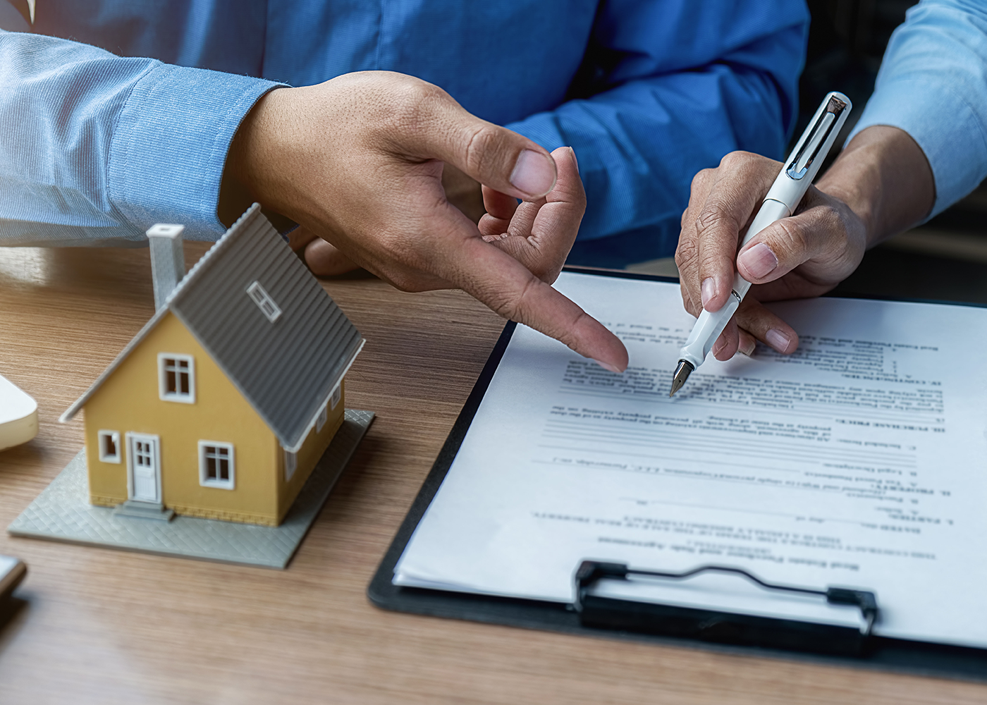 Signing home insurance paper