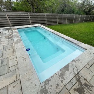 In-ground pool and backyard