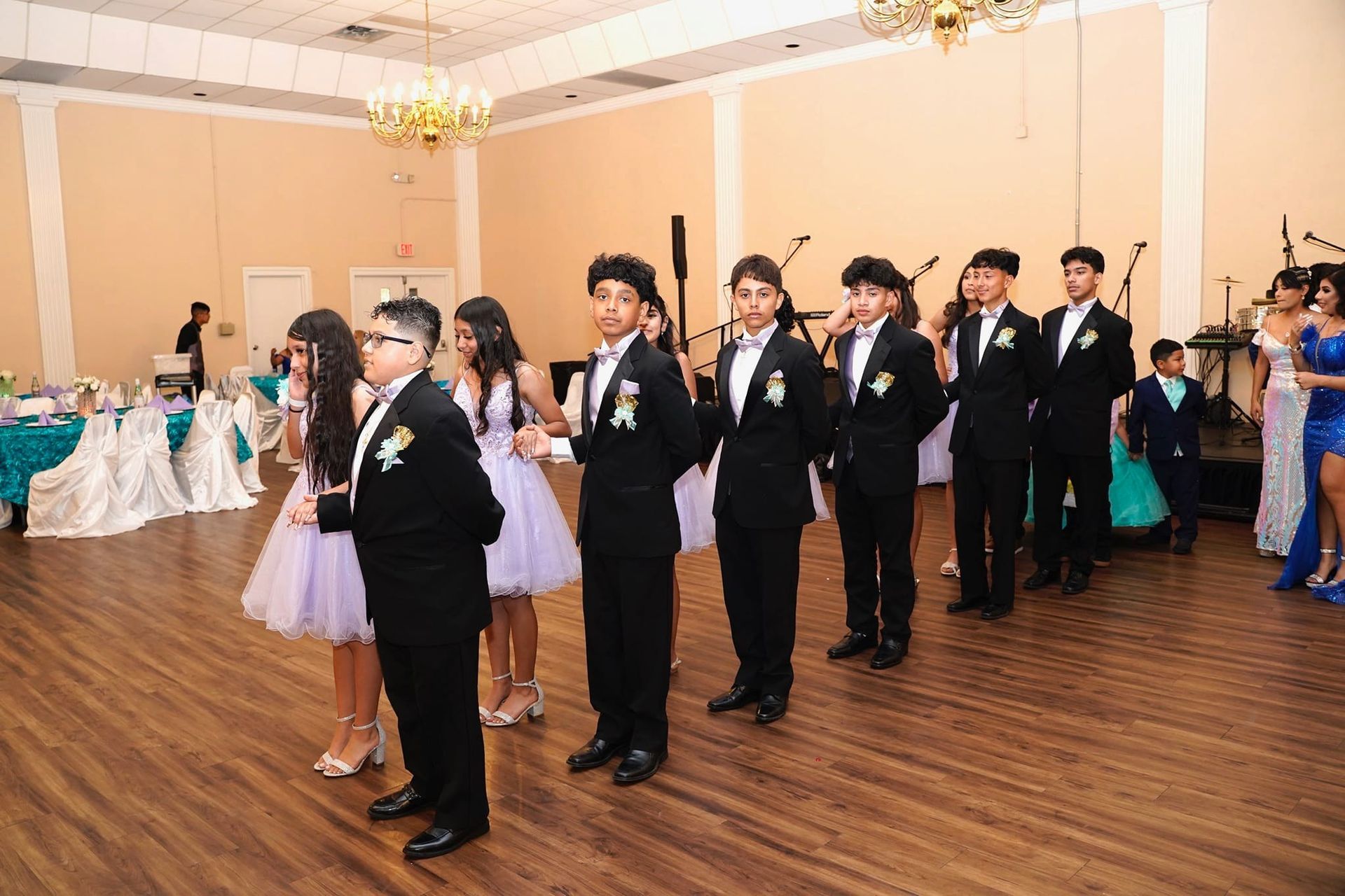 A group of people are standing in a line in a room.