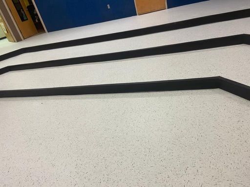 A white floor with black lines on it