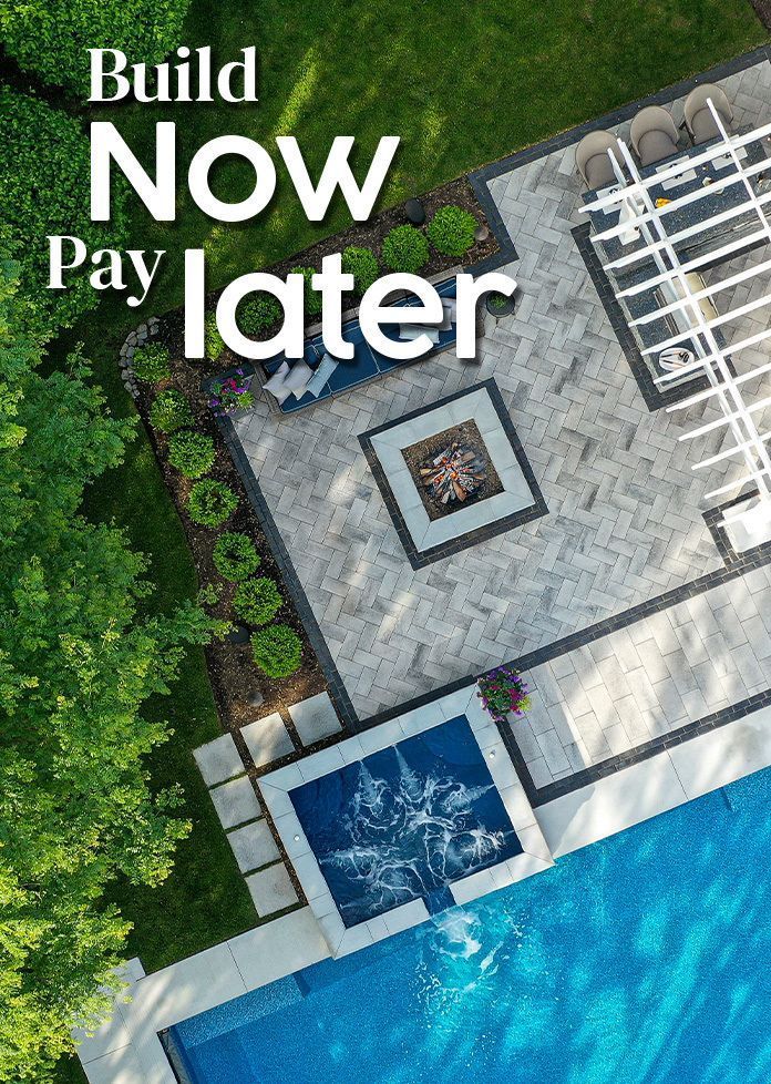 Aerial view of a patio with a fire pit and pool, overlaid with the text Build Now Pay later.