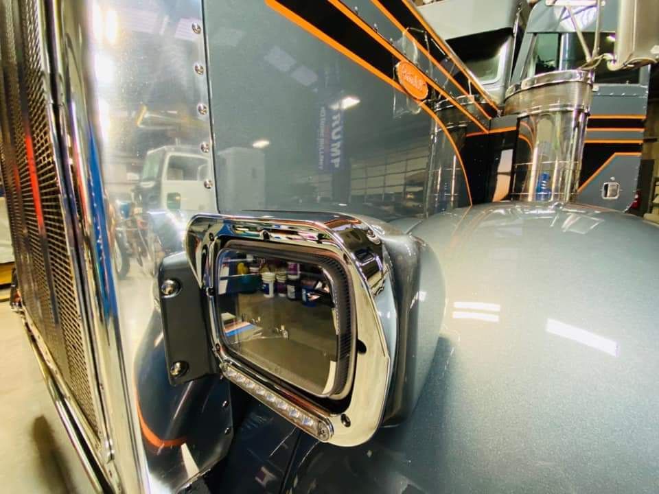A close up of a side mirror on a truck