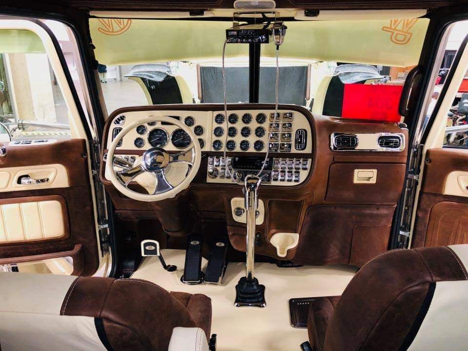 The interior of a car with a steering wheel and dashboard.