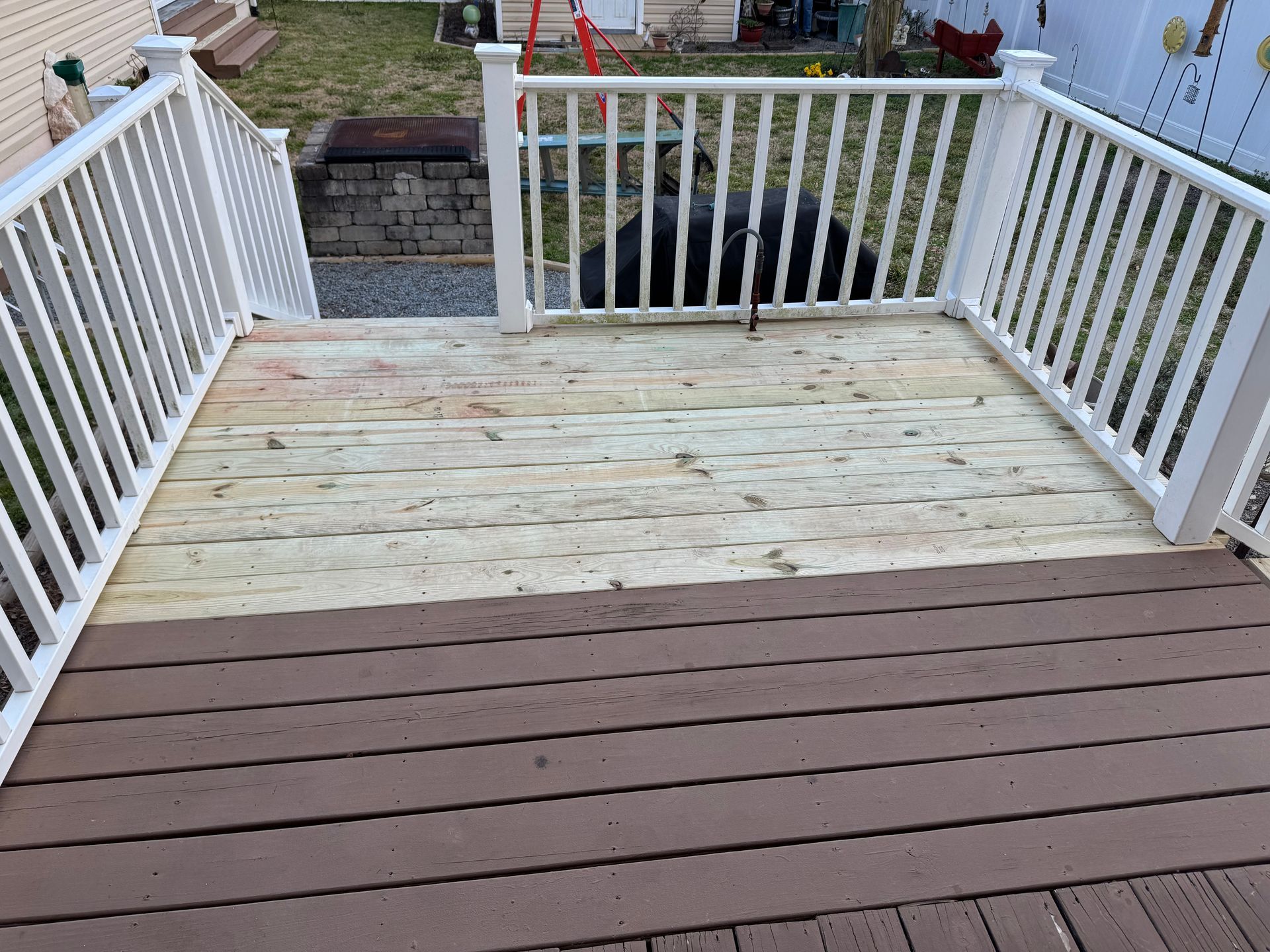 Wooden deck with white railings
