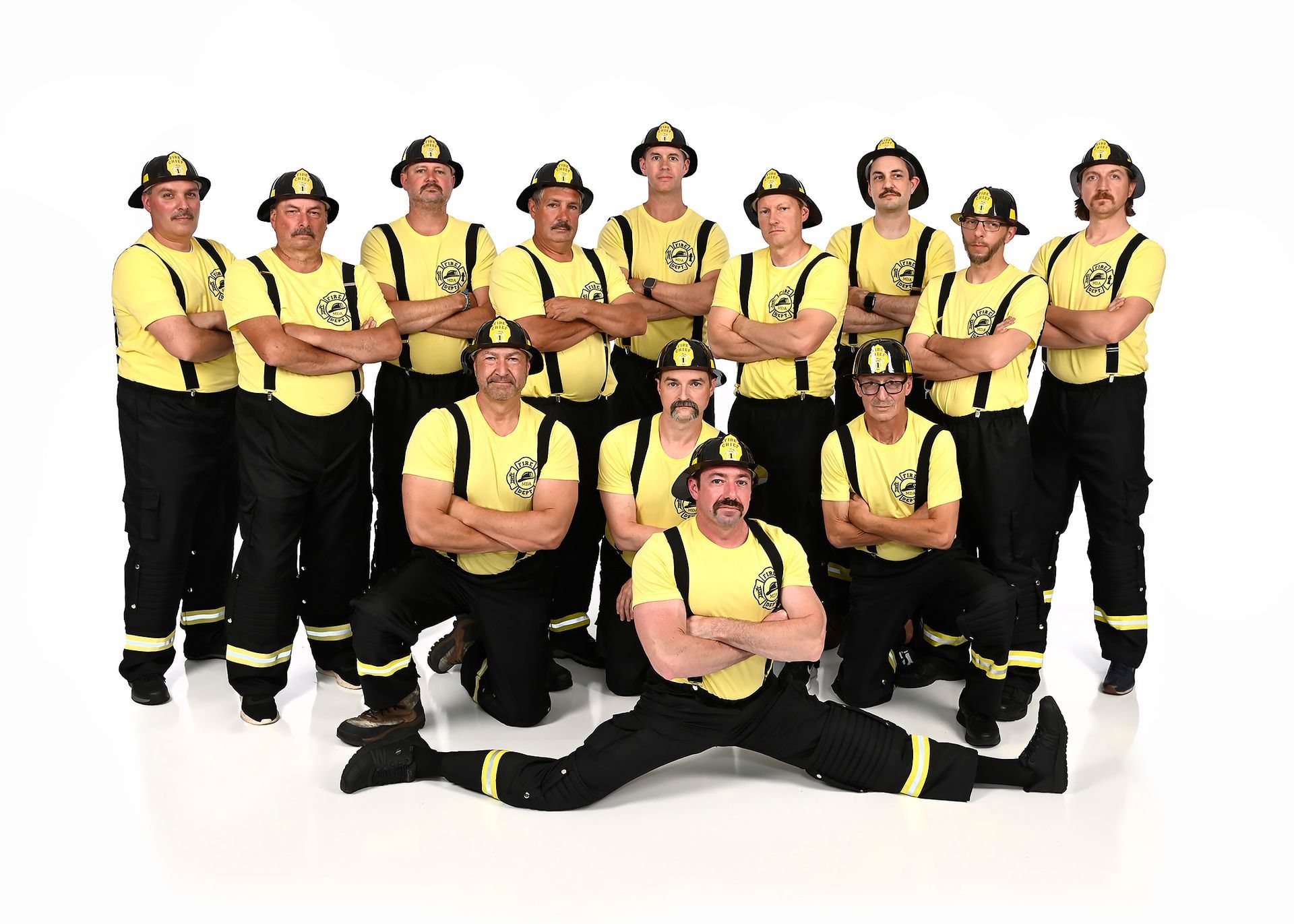 A group of men are posing for a picture in front of a boombox.