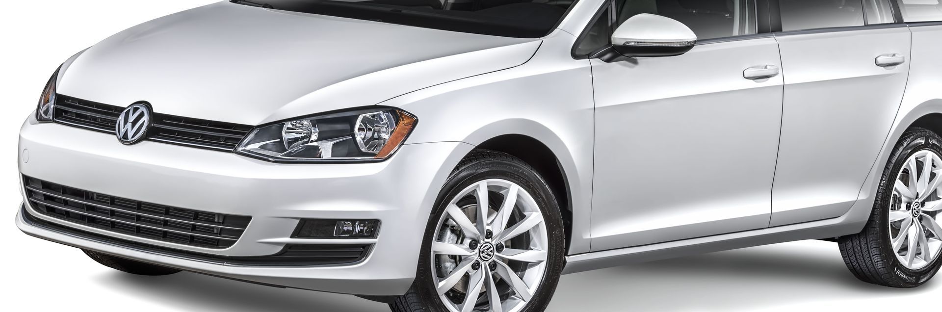 A silver Volkswagen Golf station wagon parked against a white background.