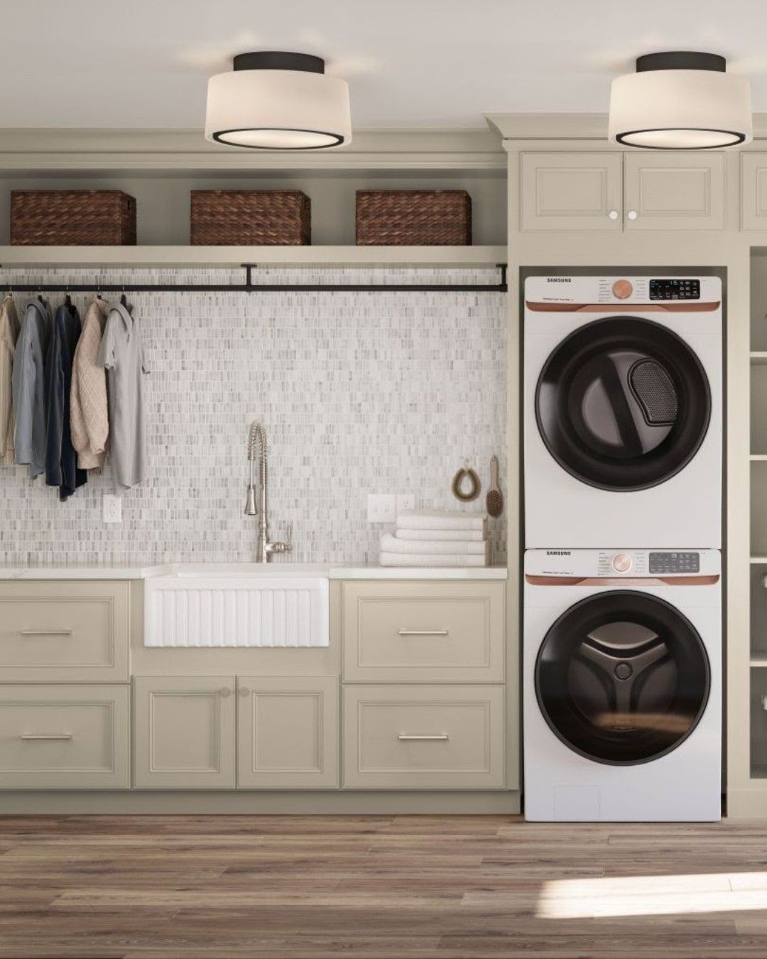 Laundry room with stacked washer/dryer, sink, cabinets, and hanging clothes.