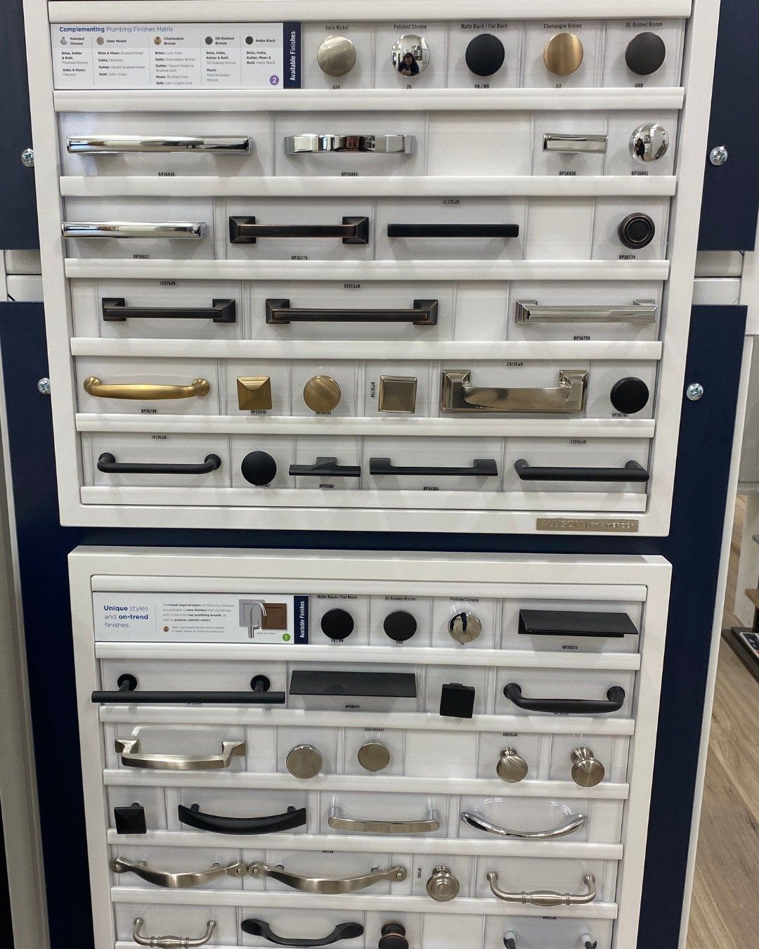 Display of cabinet hardware samples in various styles and finishes.