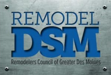 Logo for Remodel DSM, featuring blue text on a metallic gray background with screws in the corners.