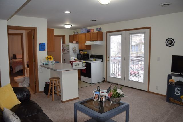 A living room with a couch and a coffee table.