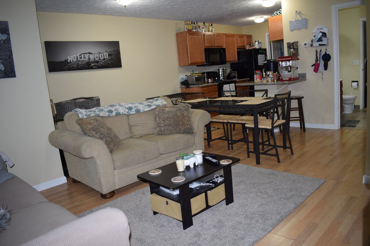 A living room with a couch and a coffee table.