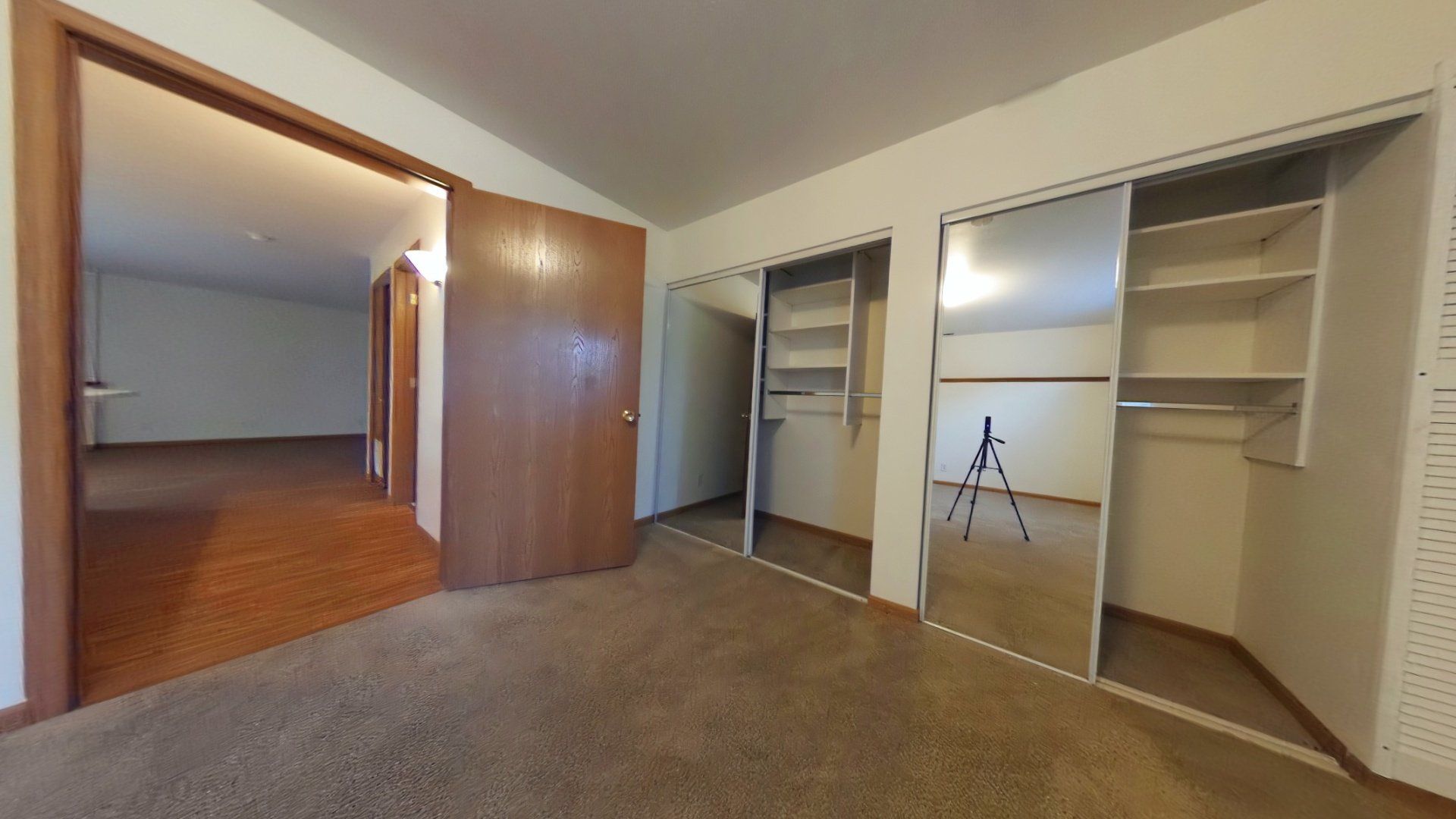 There is a tripod in the middle of the room in the closet.