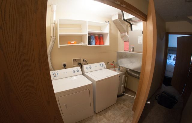 A laundry room with a washer and dryer in it.