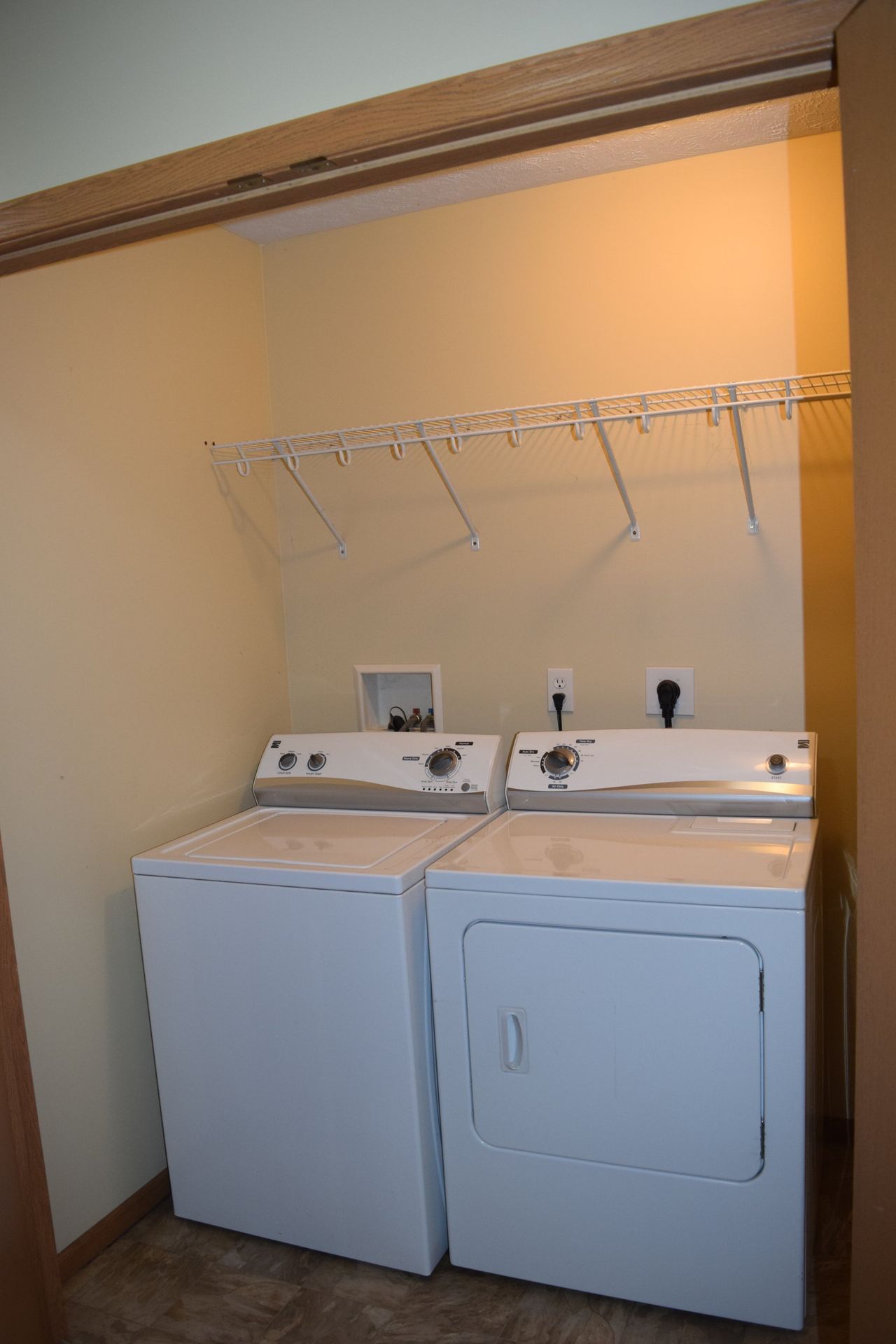 A laundry room with a washer and dryer in it.
