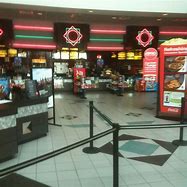 A photo taken at a movie theater by a person.