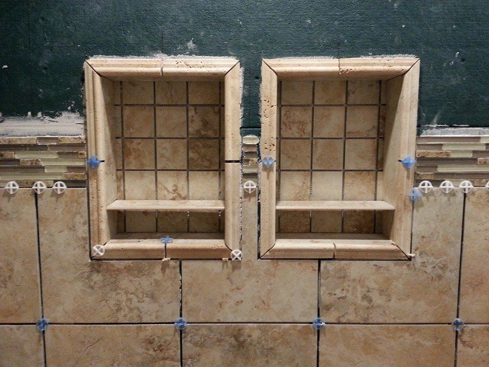 Two recessed tile niches built into a bathroom wall, ready for tiling.