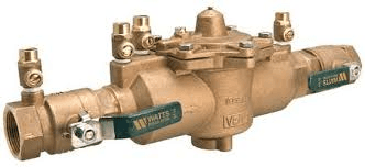 A close up of a brass valve with a green handle on a white background