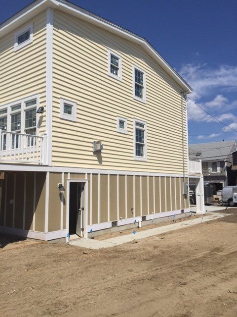 A house with a lot of windows is being built