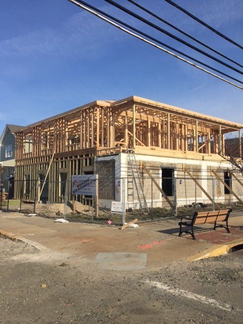 A house is being built on the side of the road